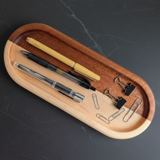 Wooden desk organizer with stationery items on a dark surface