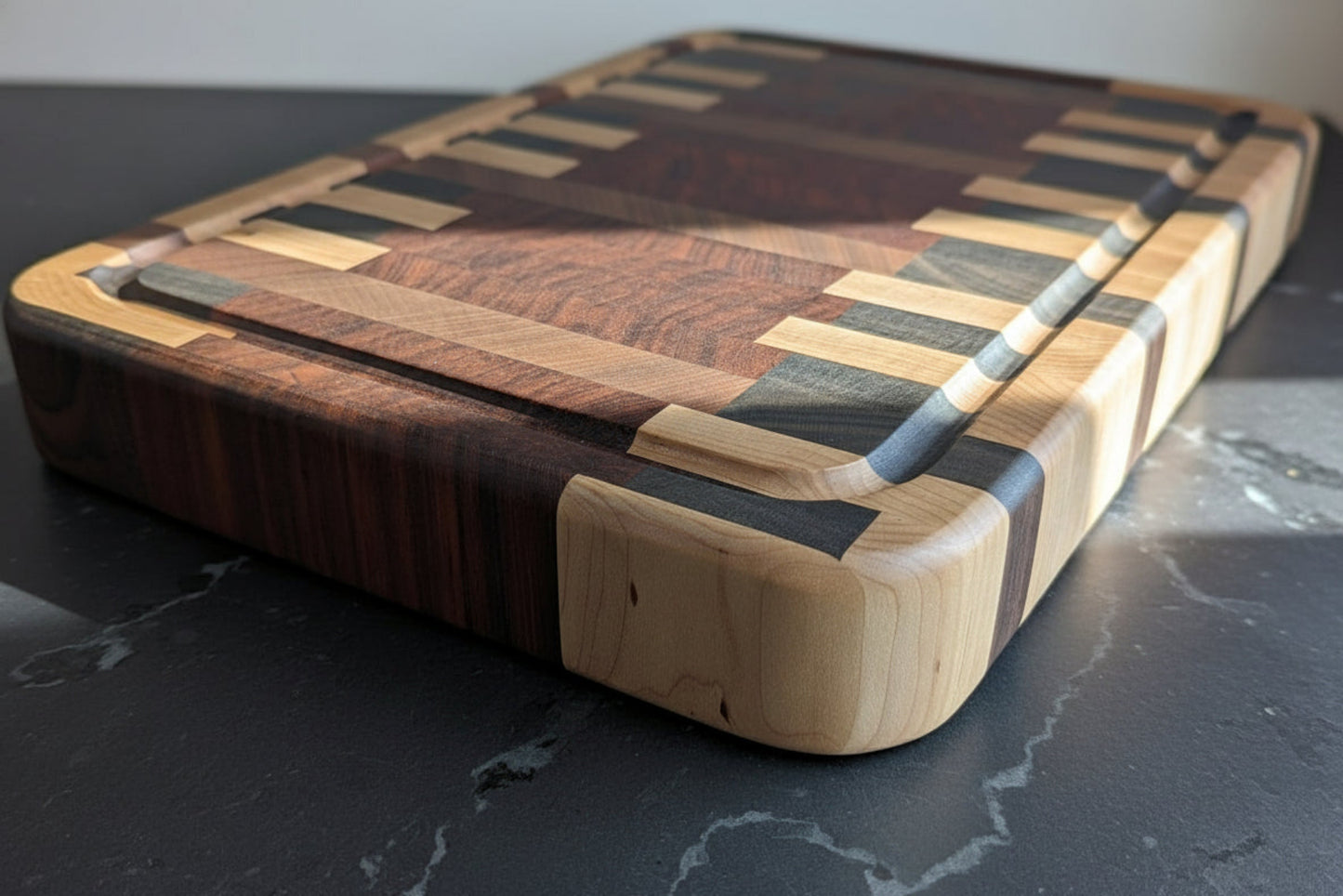 Wooden cutting board with a multicolored grain pattern on a dark surface