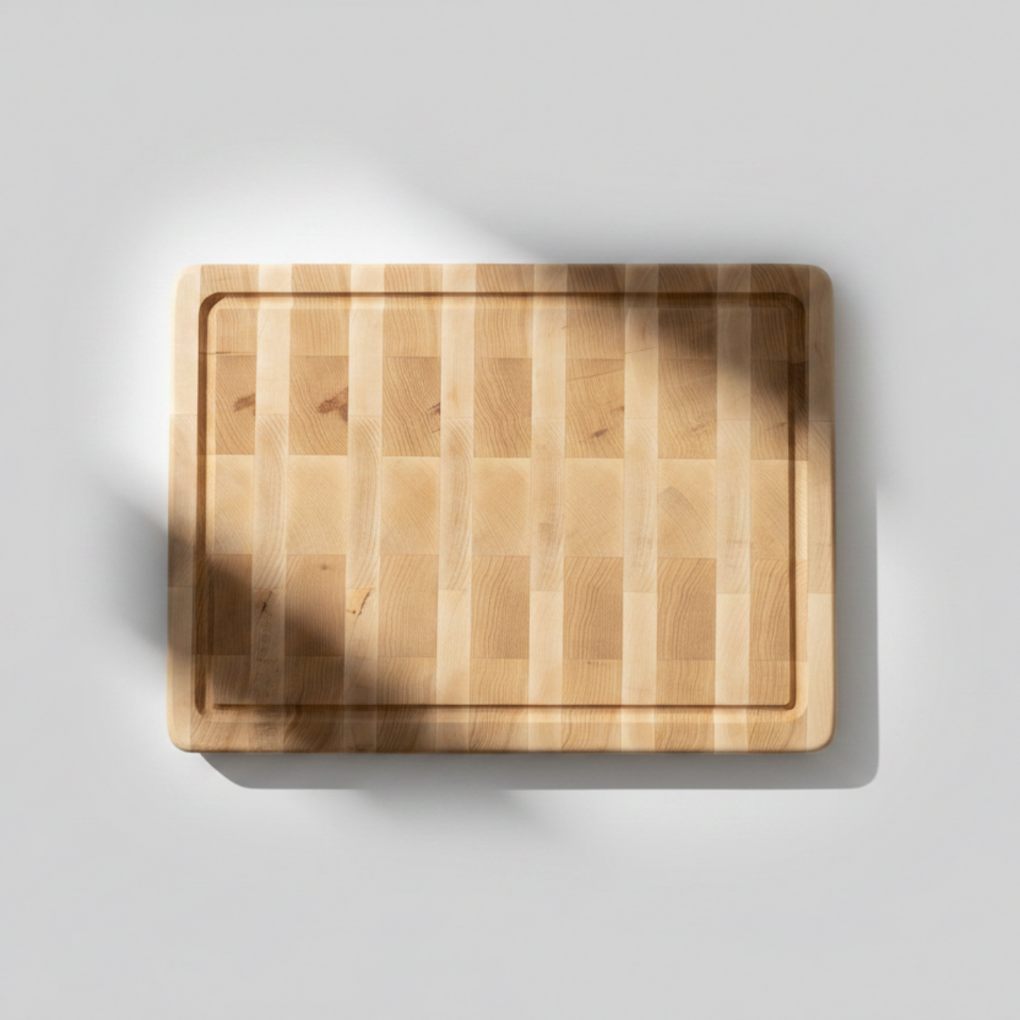 Wooden cutting board on a light gray background