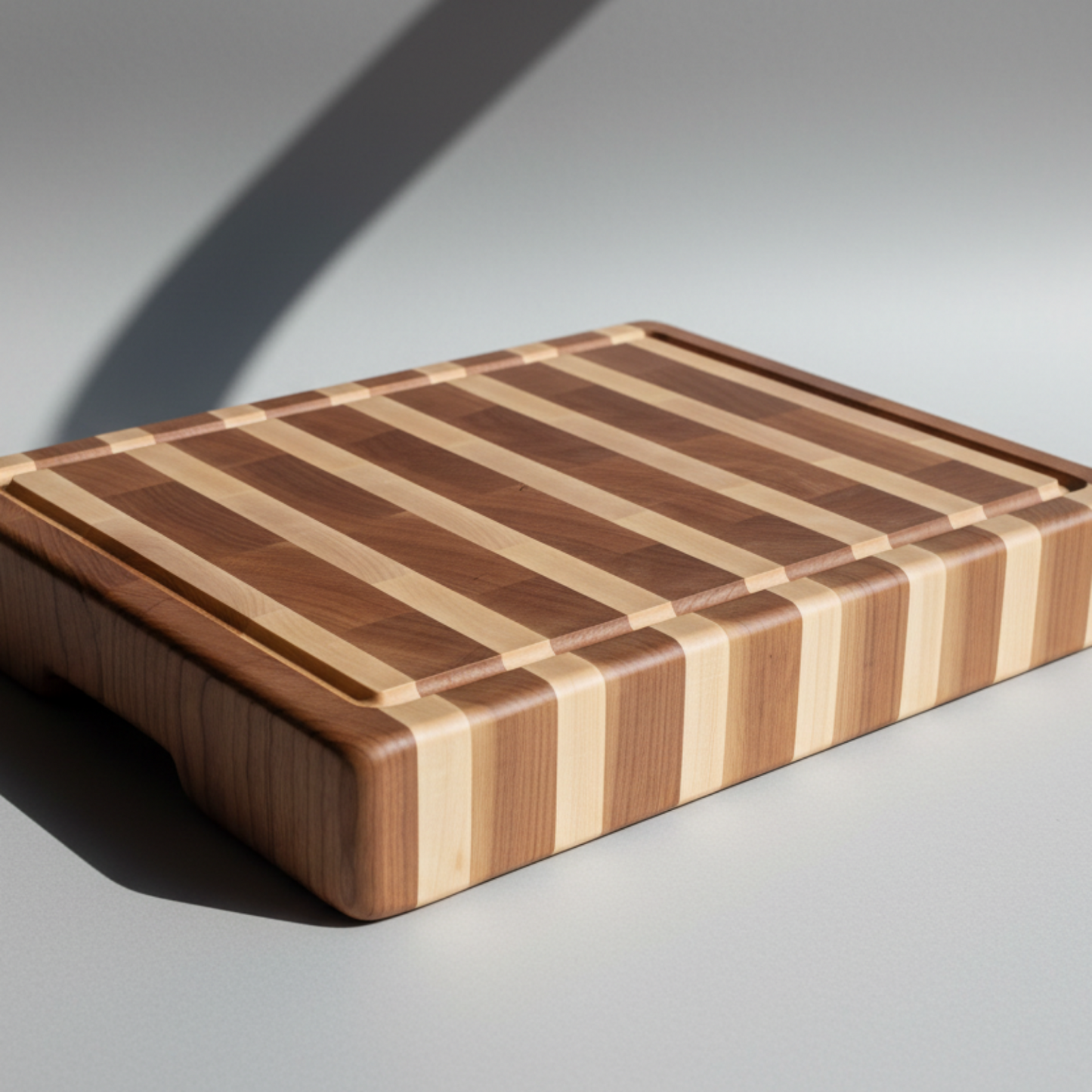Wooden cutting board with a striped pattern on a gray background