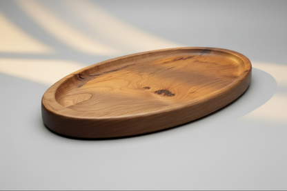 Wooden oval tray on a gray background