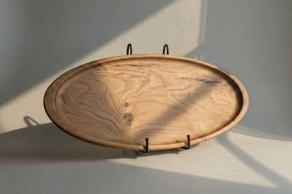 Wooden tray with metal stands on a light gray background