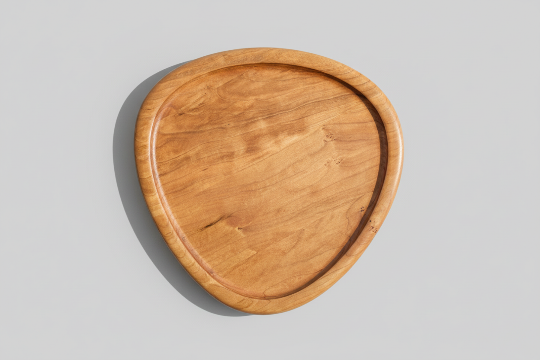 Wooden serving tray on a gray background