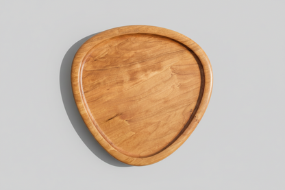 Wooden serving tray on a gray background