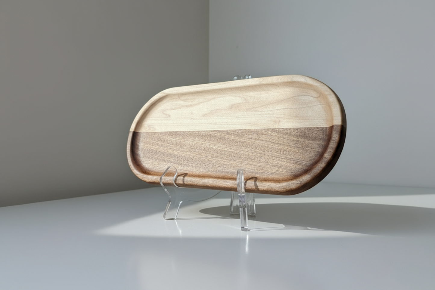 Wooden tray on a stand against a plain background
