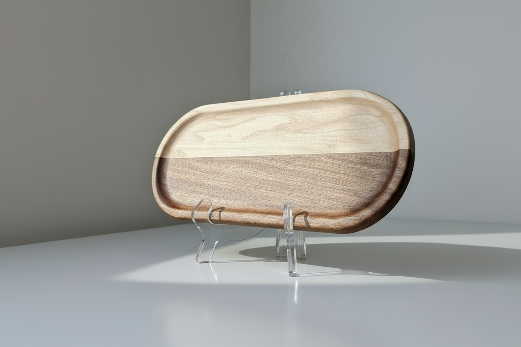 Wooden tray on a stand against a plain background
