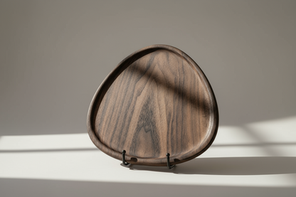 Wooden tray with a wavy pattern on a neutral background