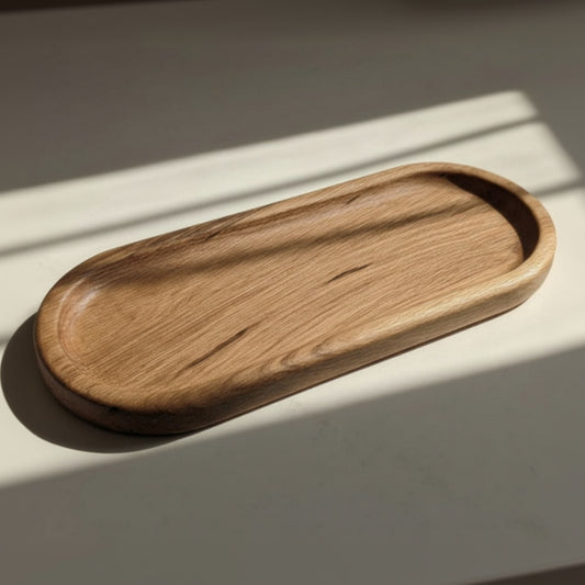 Wooden tray on a light surface with soft shadows